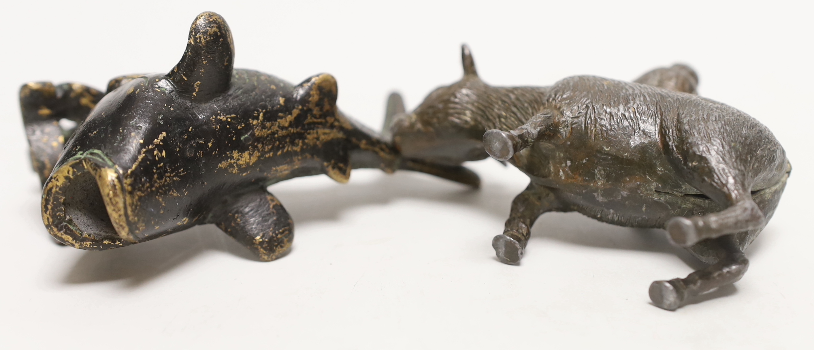 A Chinese parcel gilt metal model of a figure reading a scroll on a fish and one riding a buffalo, tallest 9cm